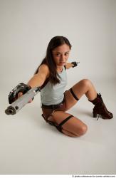 Woman Adult Average Fighting with gun Kneeling poses Casual Latino